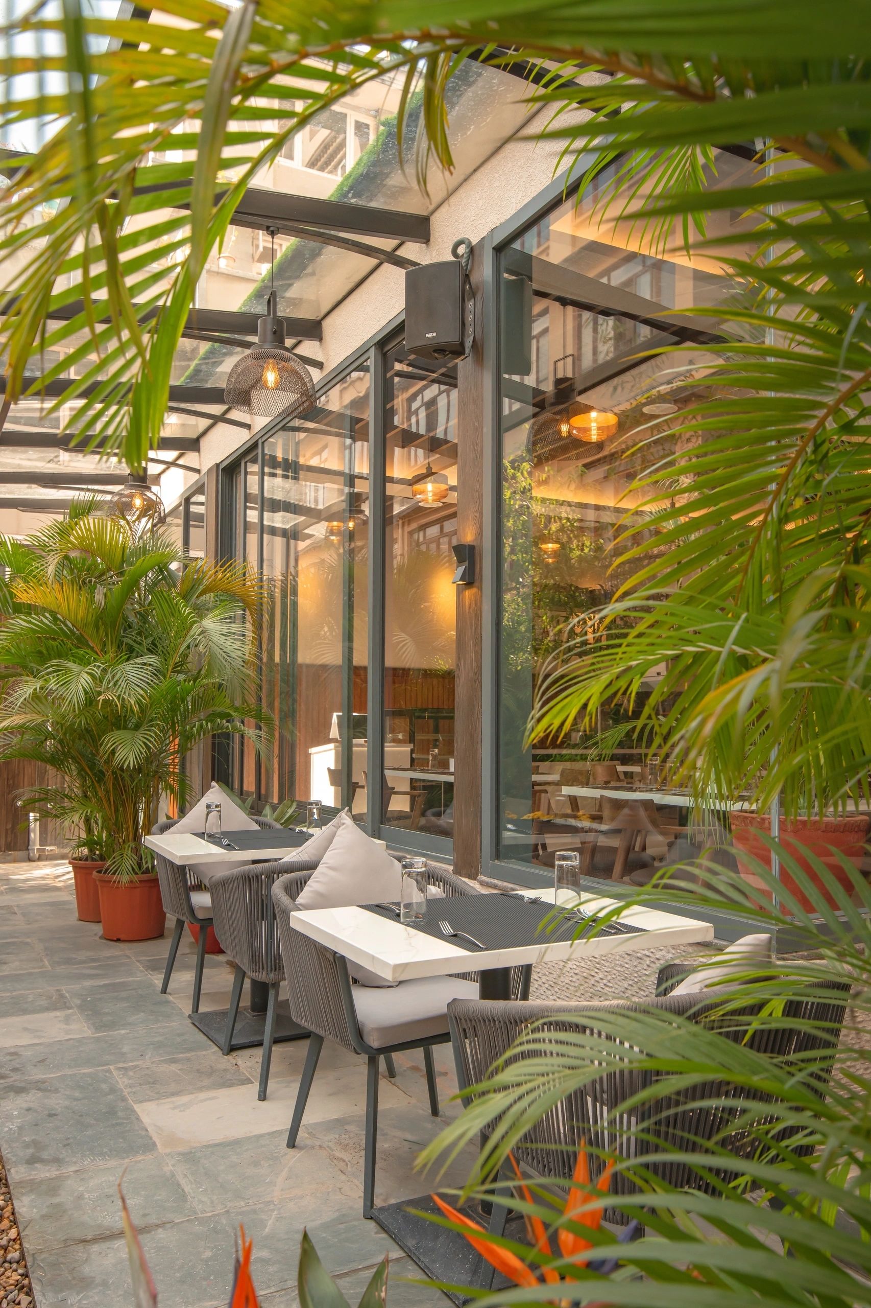 Garden courtyard cafe — alfresco dining in Mila Hotel